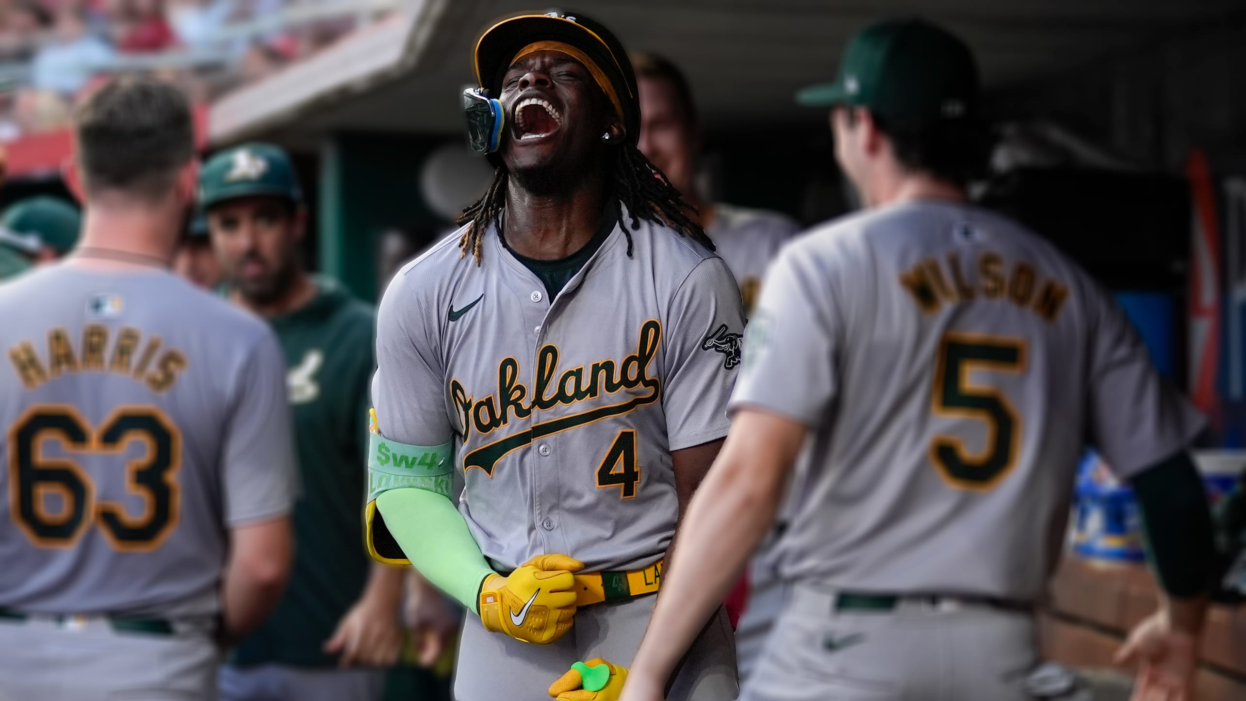 Lawrence Butler screams with excitement in the dugout after hitting a game-tying home run