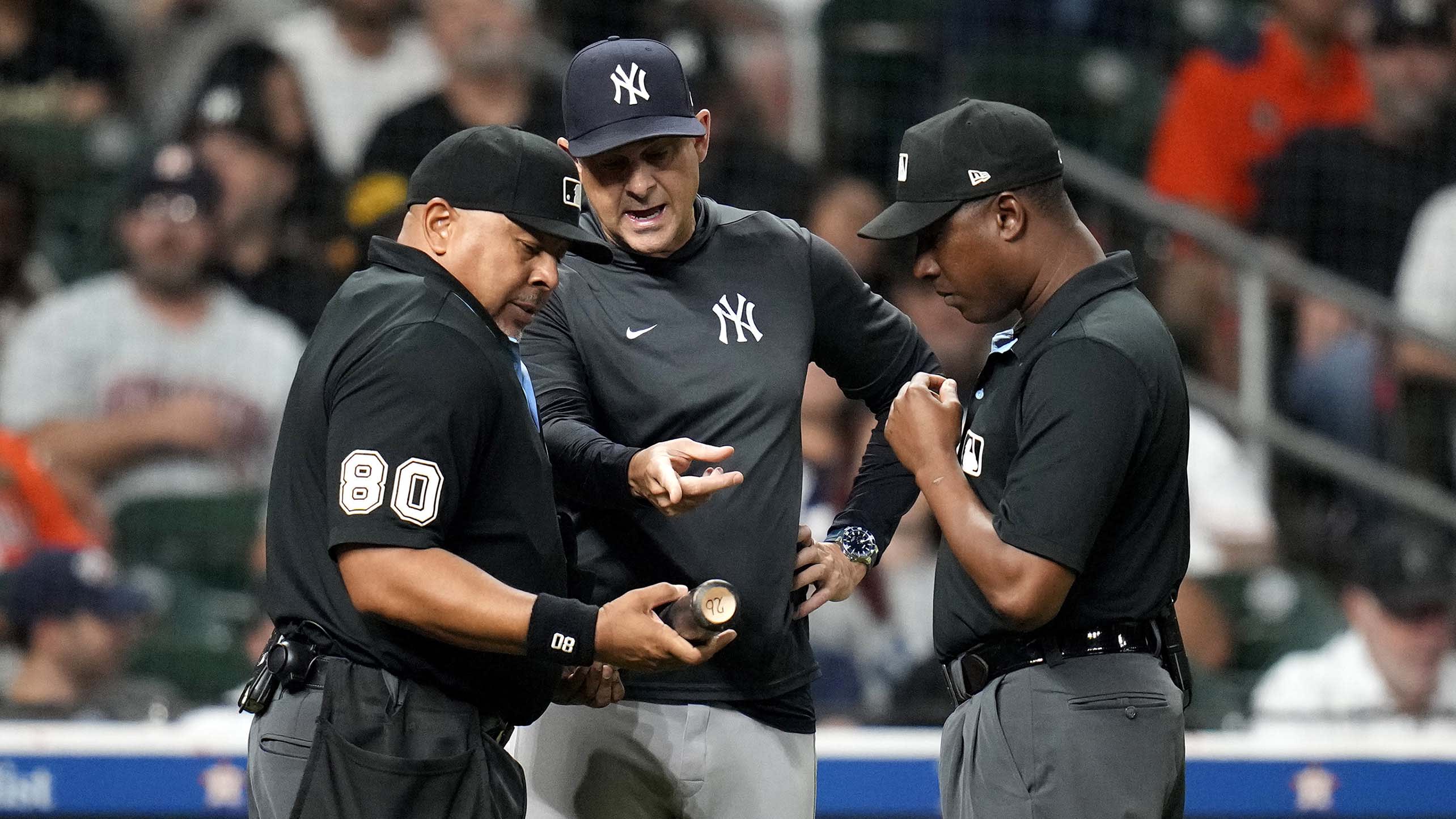 Aaron Boone has the umpires check Taylor Trammell's bat