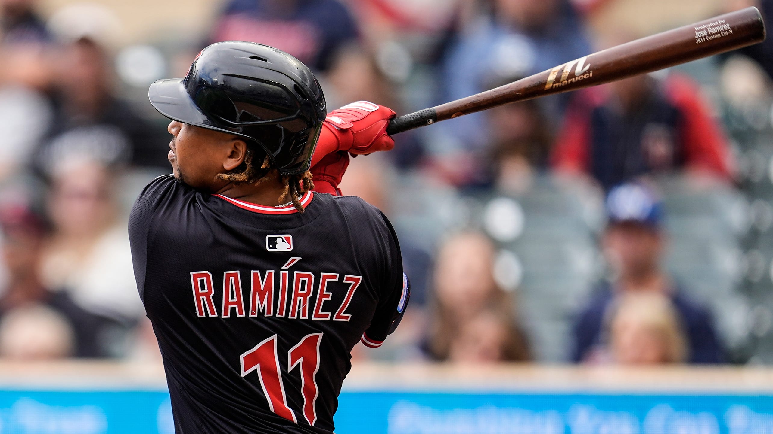 José Ramírez watches the flight of a home run