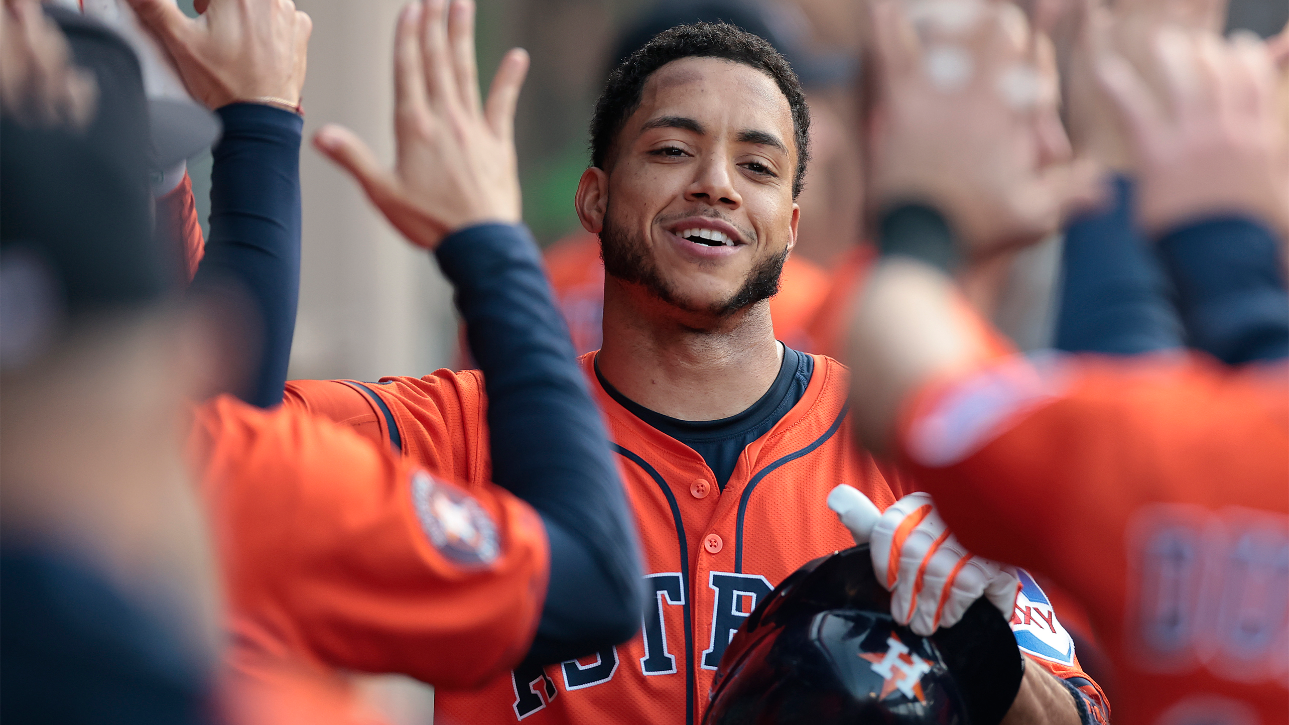 Jeremy Peña high-fives teammates in the dugout