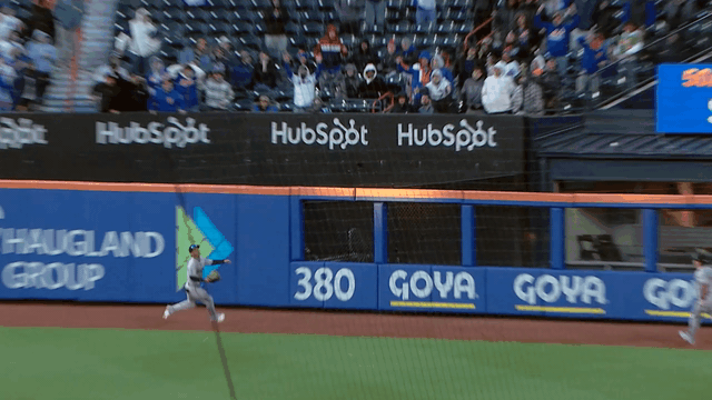An animated gif of Jorge Barrosa making a sliding catch on the warning track