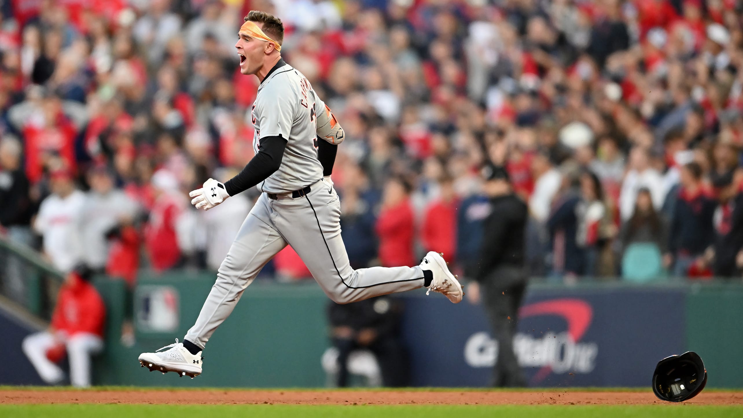 Kerry Carpenter loses his helmet as he leaps around the bases