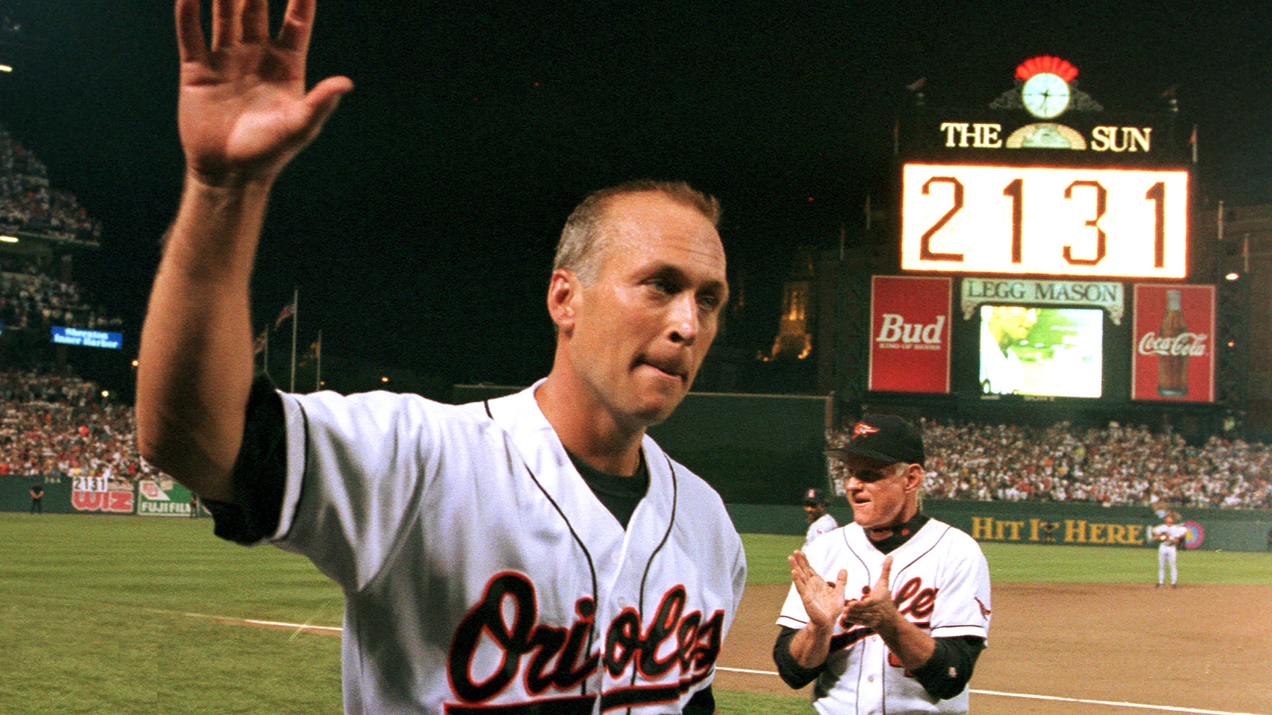 Cal Ripken Jr. waves to fans on Sept. 6, 1995, after playing in his 2,131st consecutive game