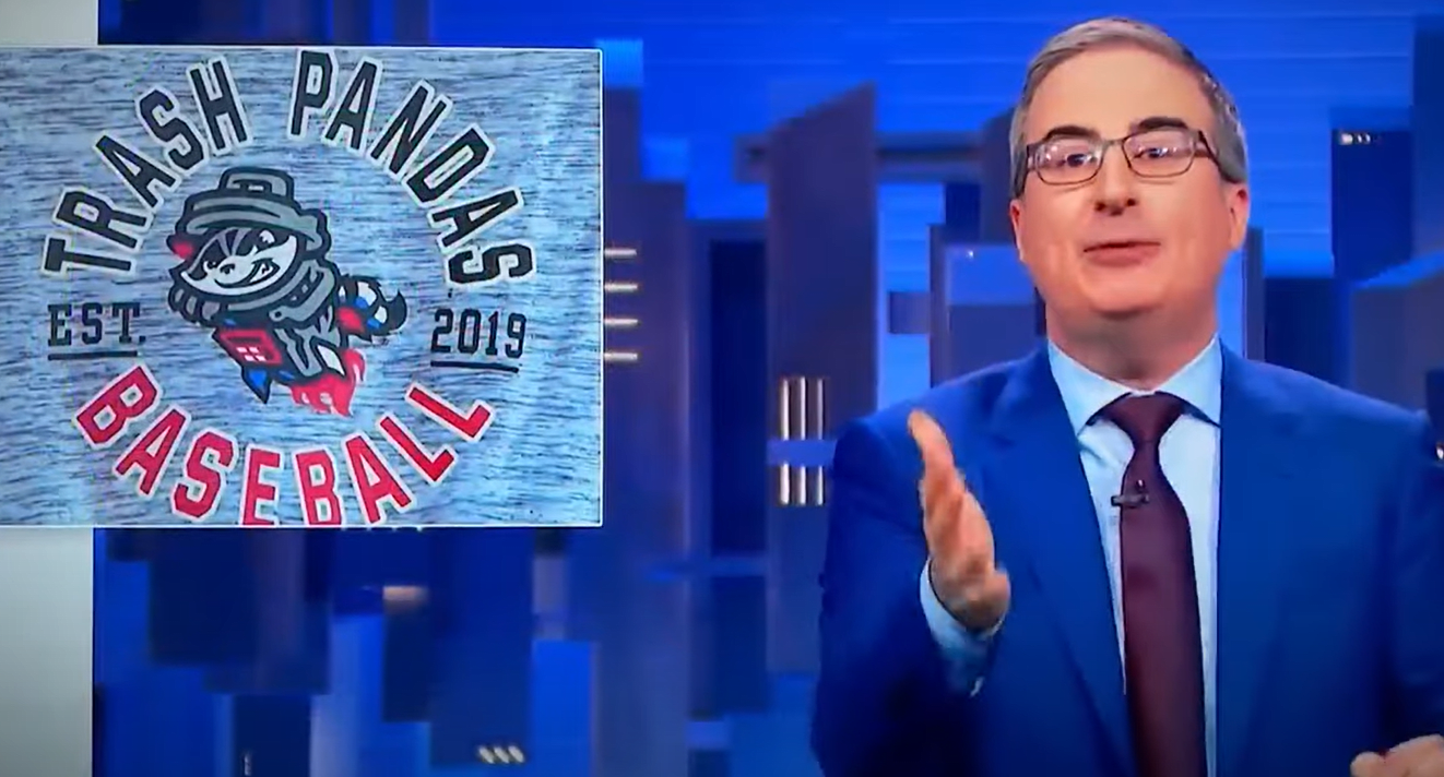 John Oliver wearing a Rocket City Trash Pandas hat