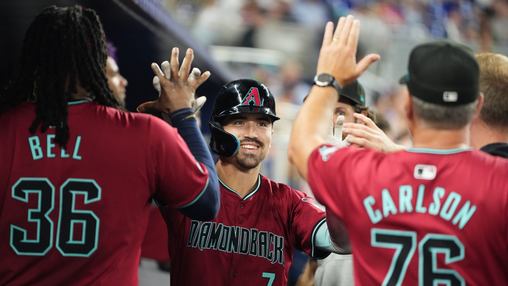 Corbin Carroll celebrates in the dugout