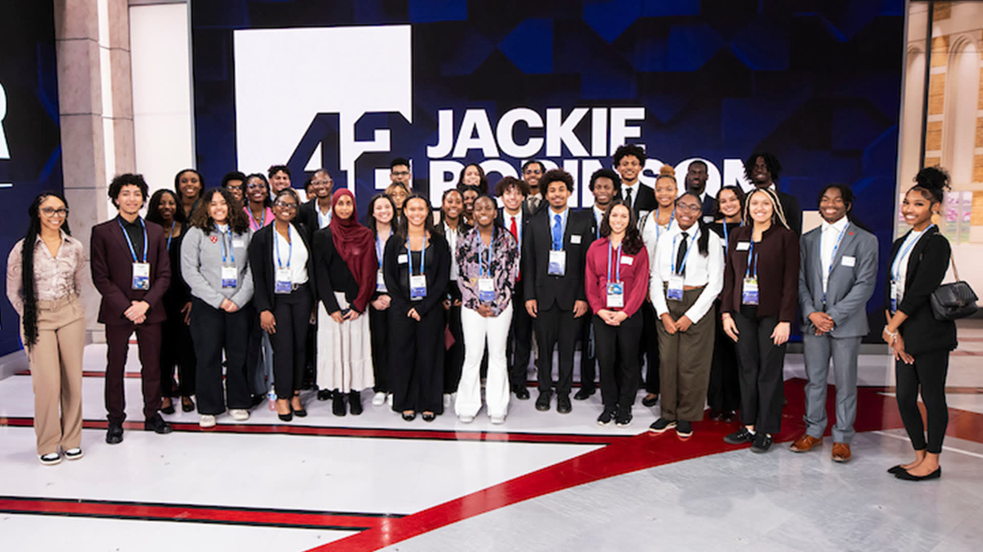 Students in the Jackie Robinson Foundation Scholars program pose for a group photo at MLB Network studios