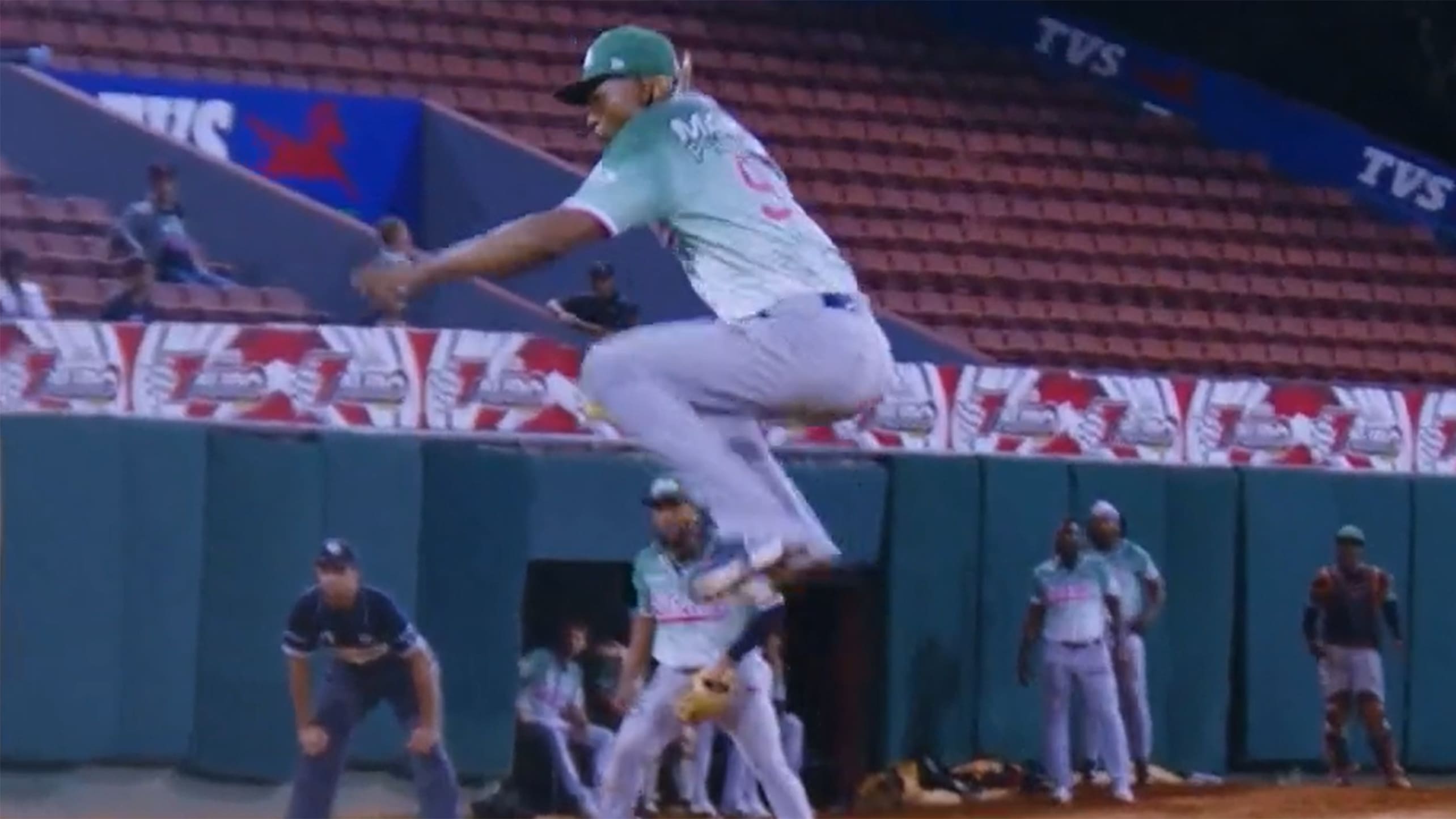 Jefry Yan leaps in the air after a strikeout