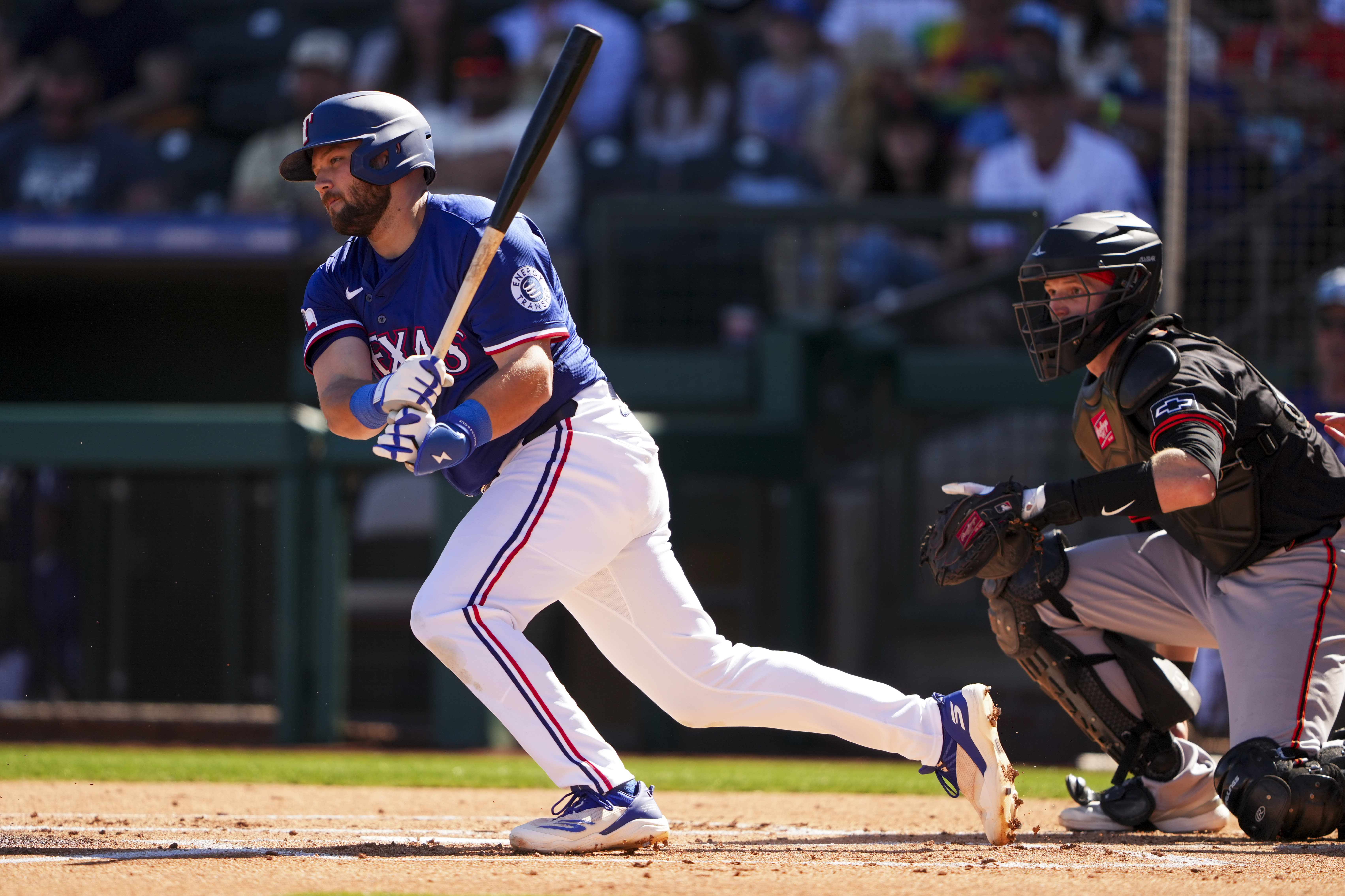 Jake Burger follows through on a swing