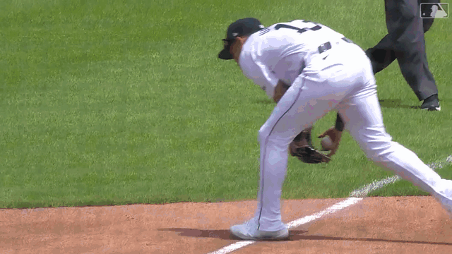 Gio Urshela makes a throw to first from foul territory