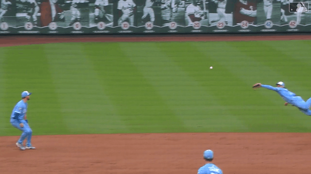 An animated gif of Bobby Witt Jr. going fully airborne to make a diving catch