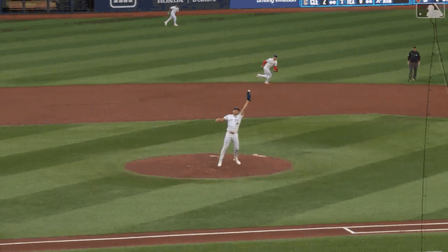 An animated gif of Trey Yesavage bobbling the ball before making an out