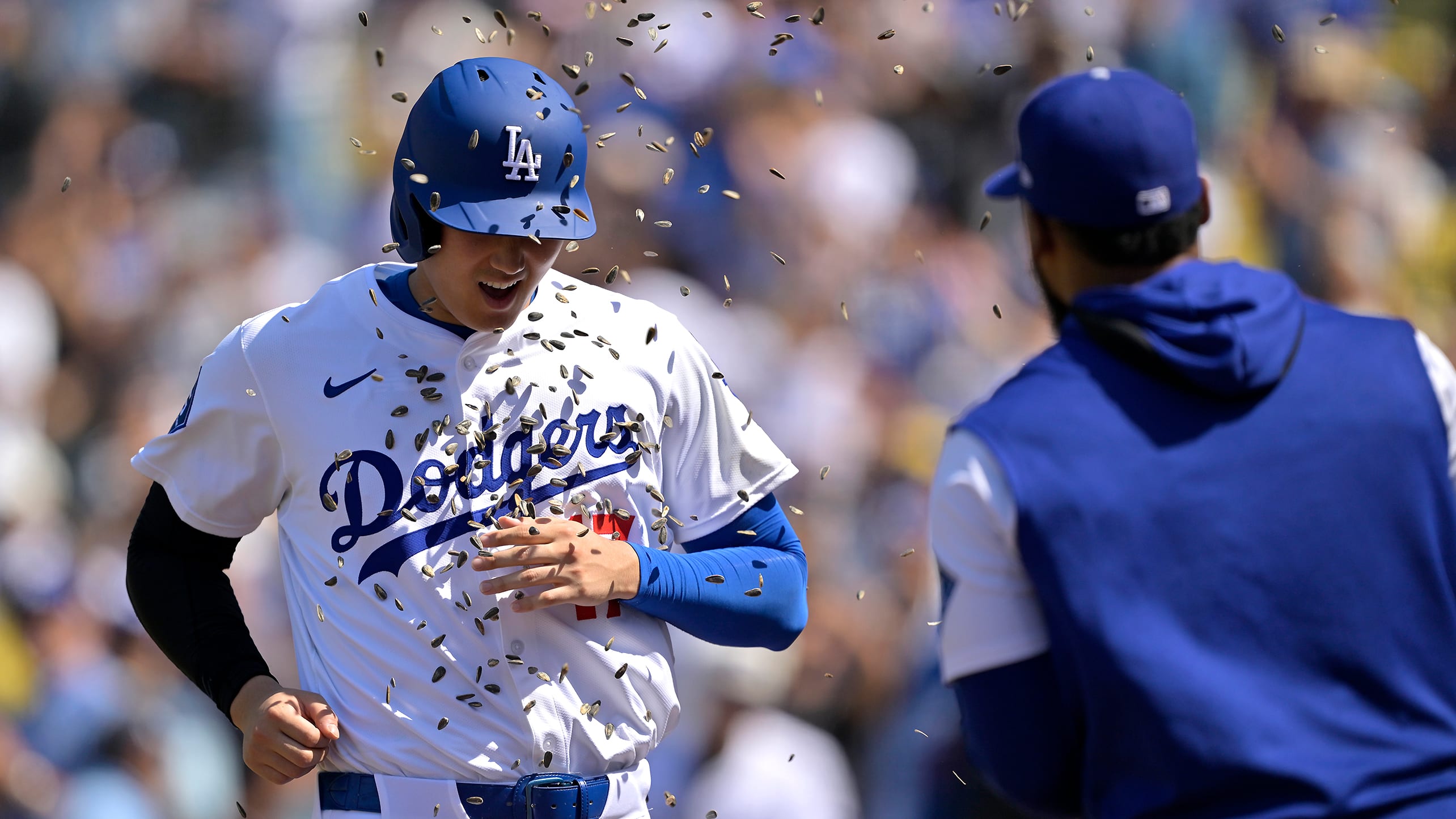 Shohei Ohtani is showered with sunflower seeds after hitting a home run