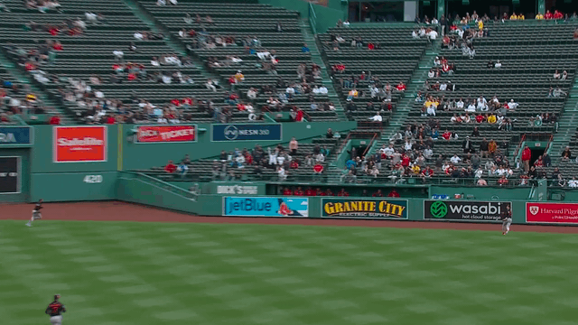 An animated gif of Orioles right fielder Heston Kjerstad reaching over the right-field wall at Fenway Park to rob a home run