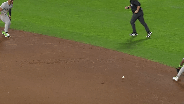 An animated gif of Jazz Chisholm Jr. making a sliding stop up the middle and twisting, off-balance throw to first