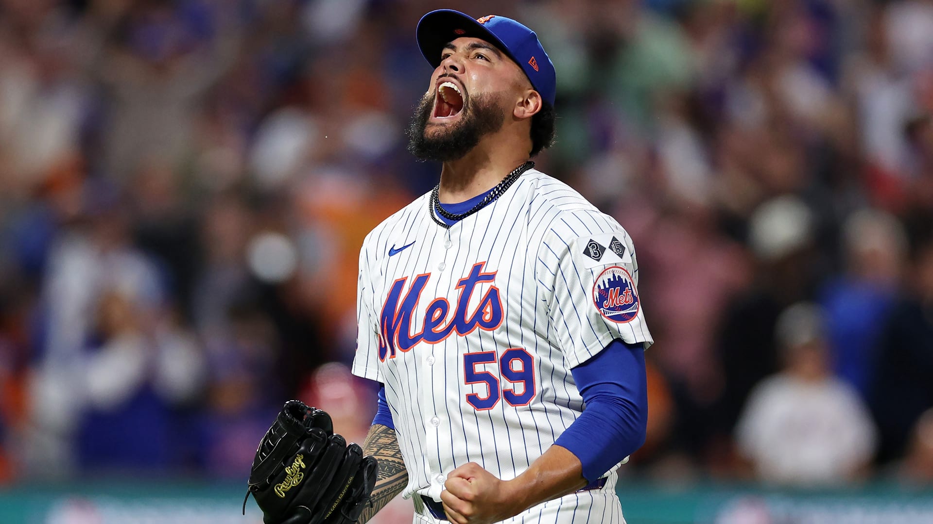 Sean Manaea clenches his fists and screams toward the sky