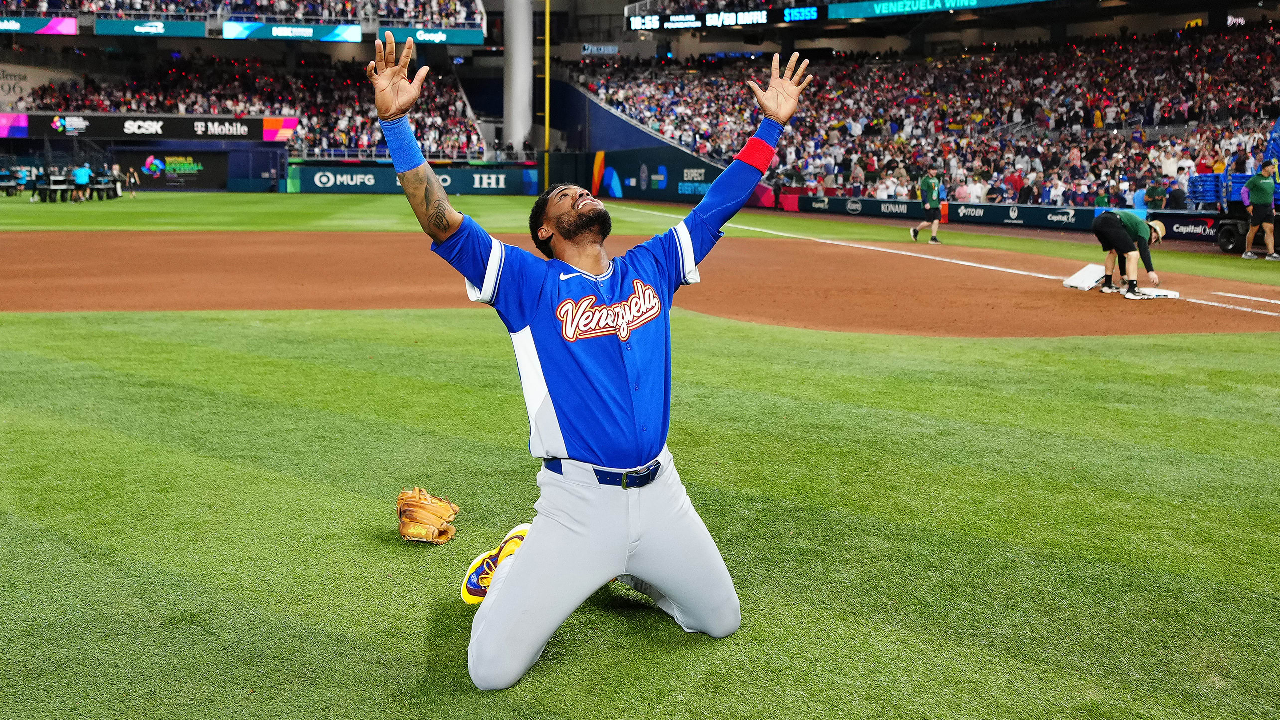 Maikel Garcia on his knees after winning the World Baseball Classic