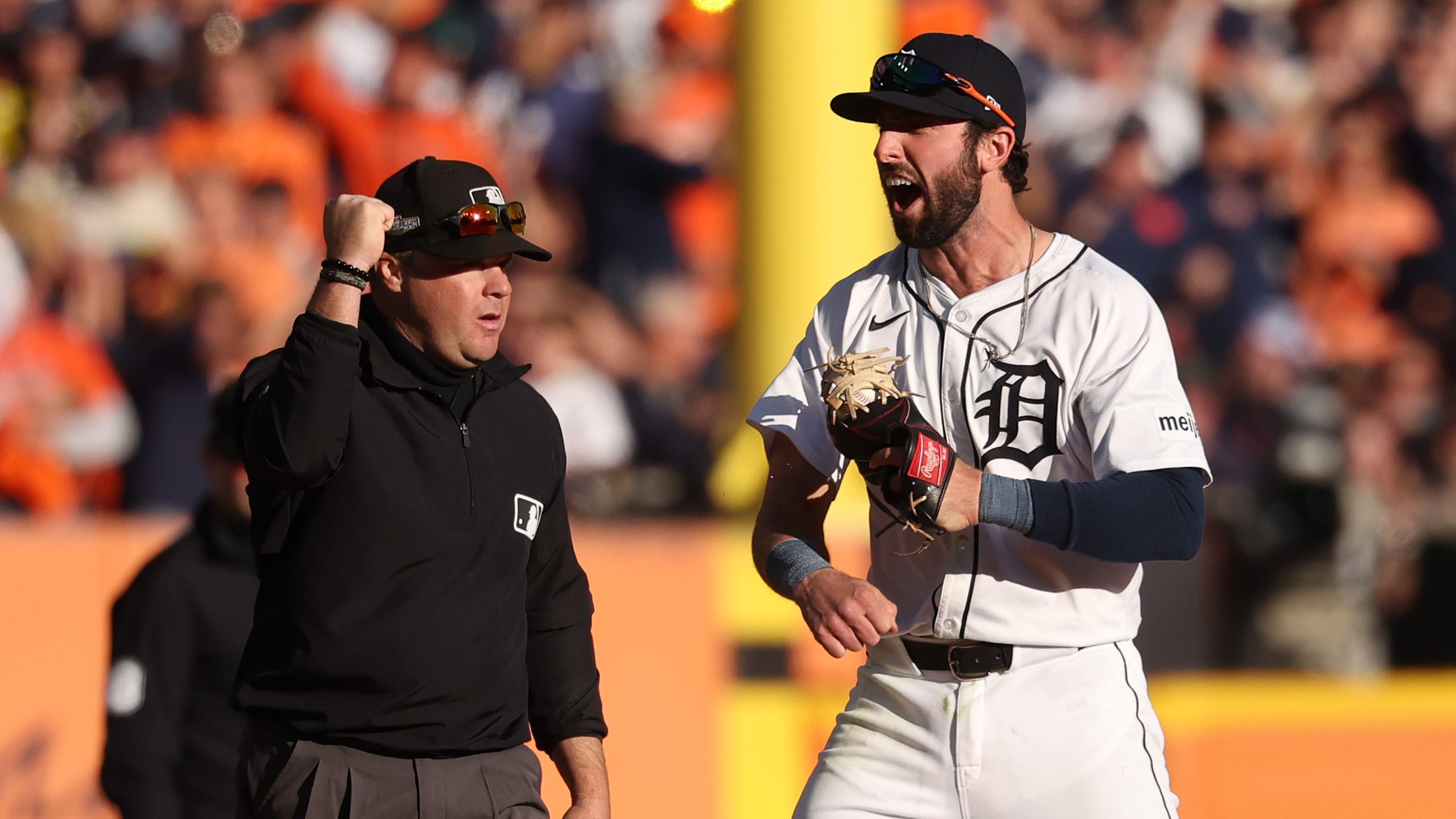 Matt Vierling celebrates as the third-base umpire signals the batter is out