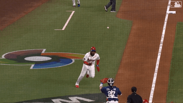 An animated gif of Vladimir Guerrero Jr. diving into home plate
