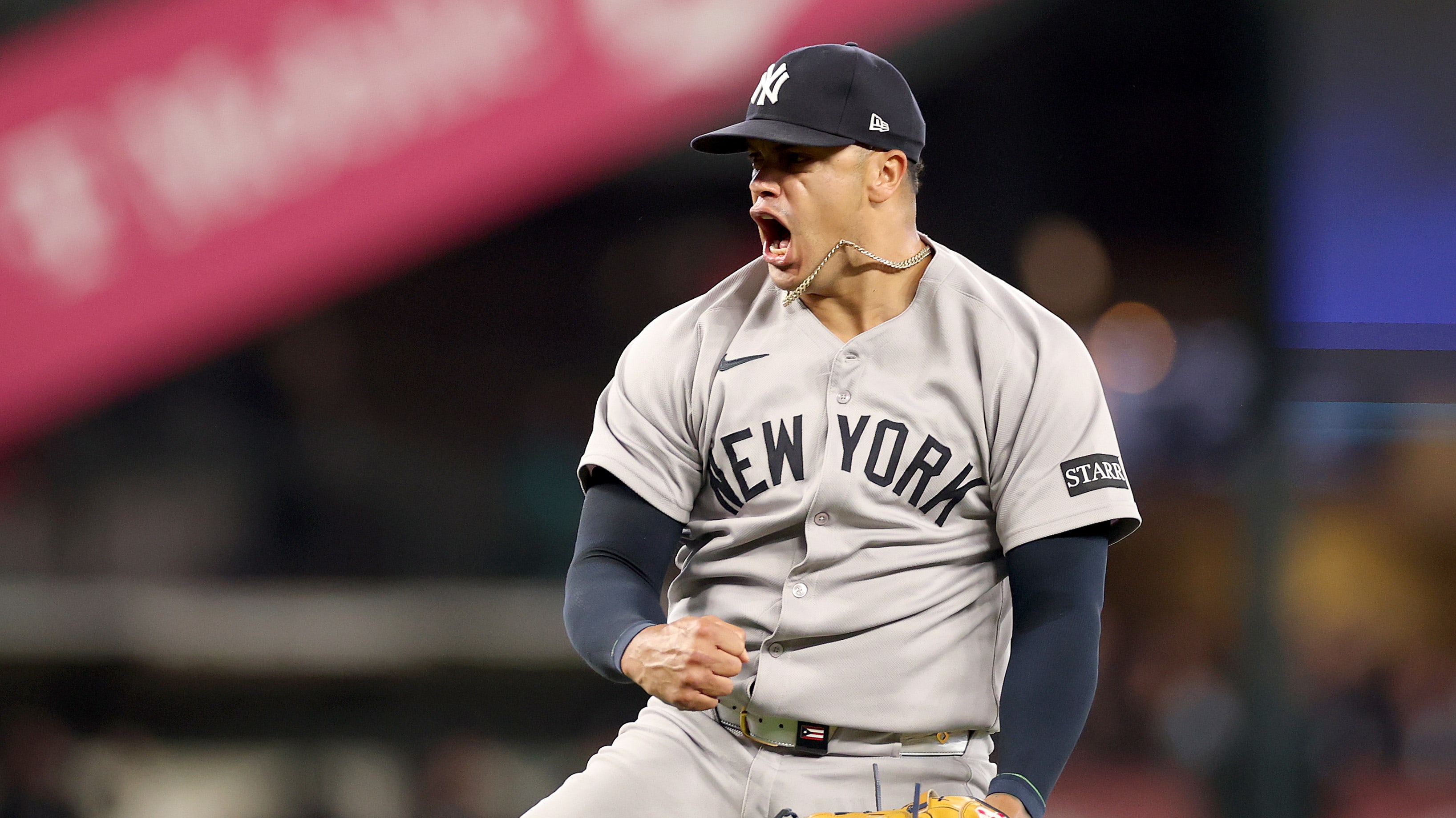 Fernando Cruz yells as he celebrates a strikeout