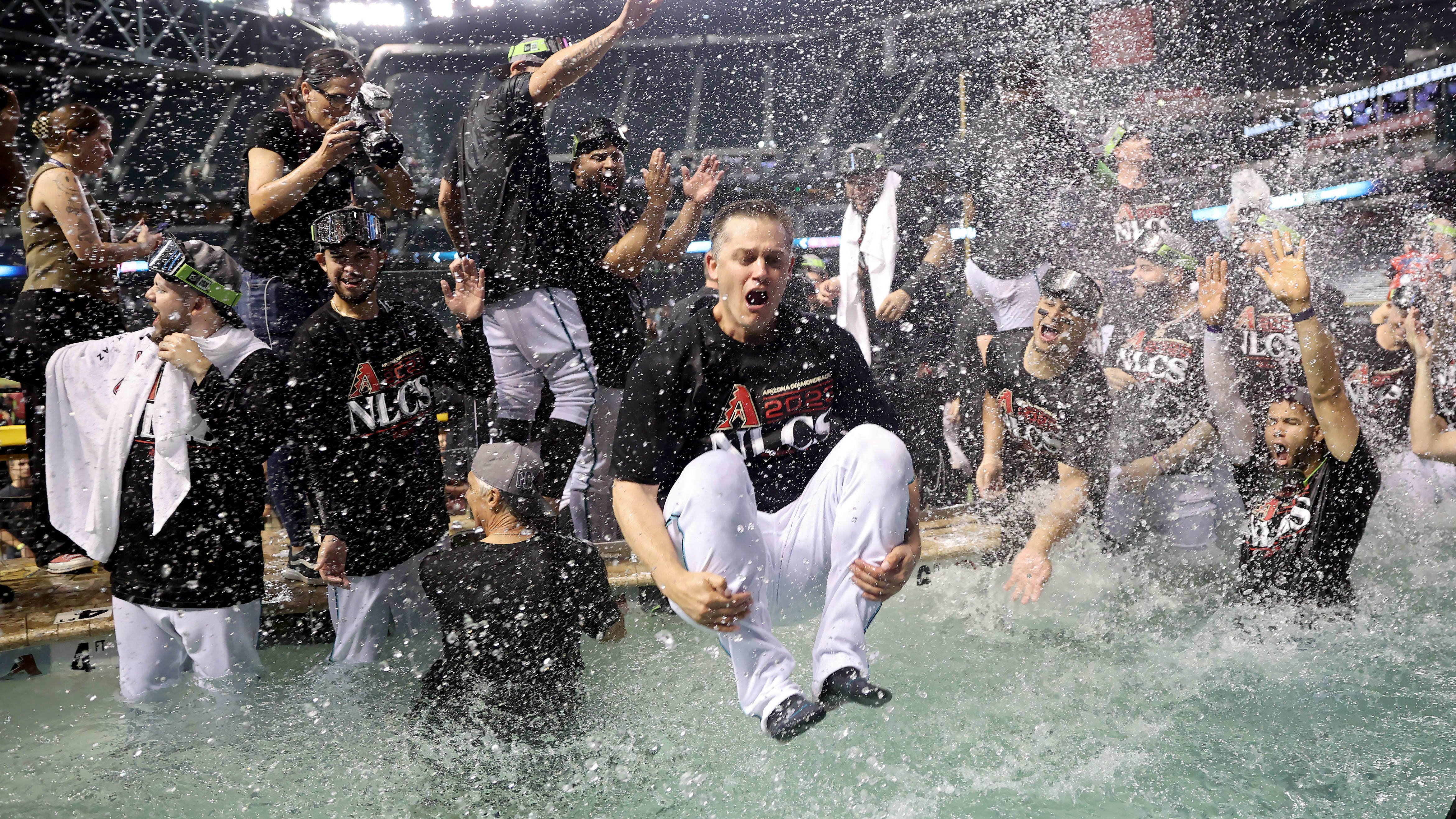 The D-backs celebrate by jumping into the pool at Chase Field