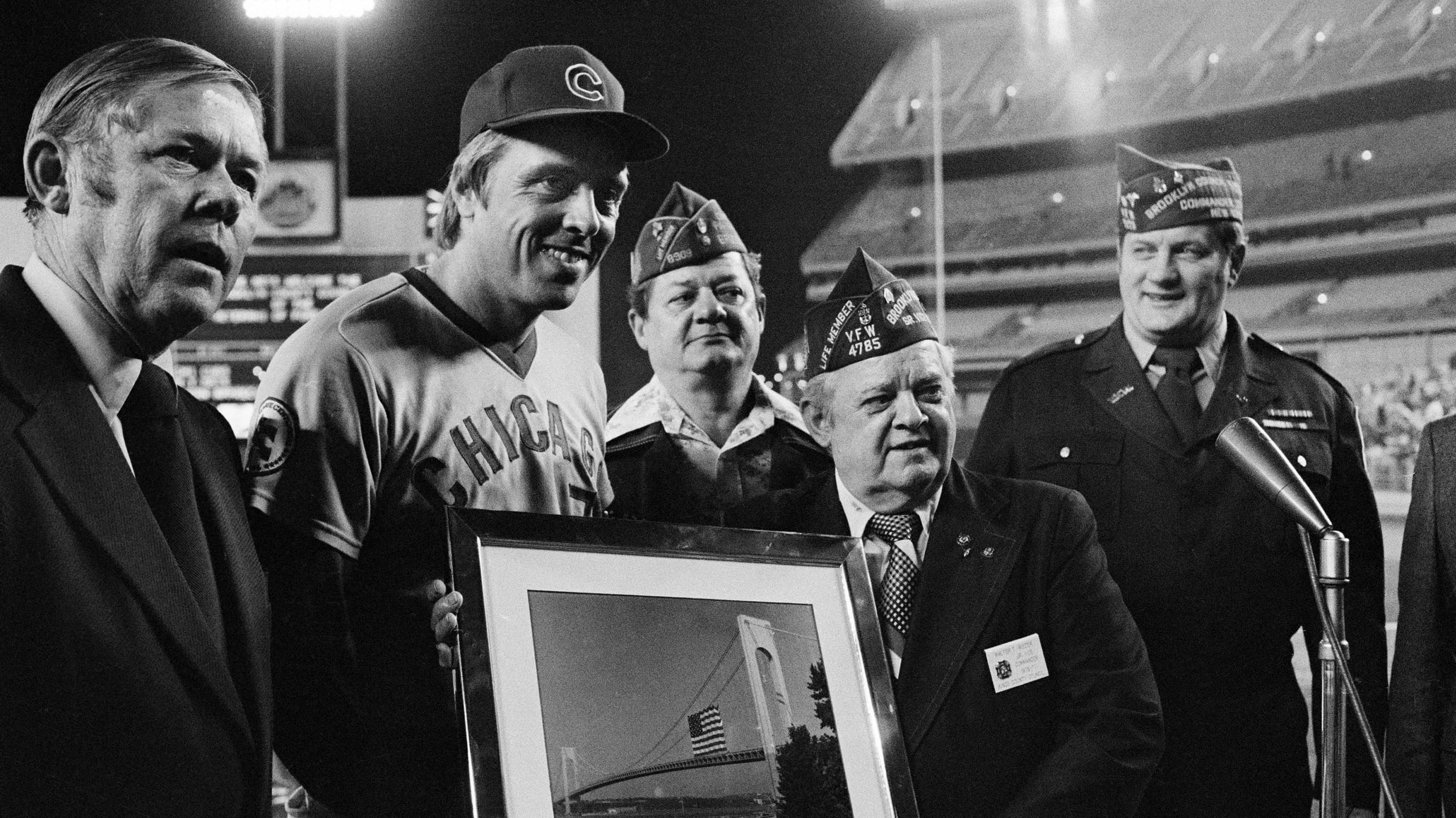 Rick Monday being presented with a photo by military veterans