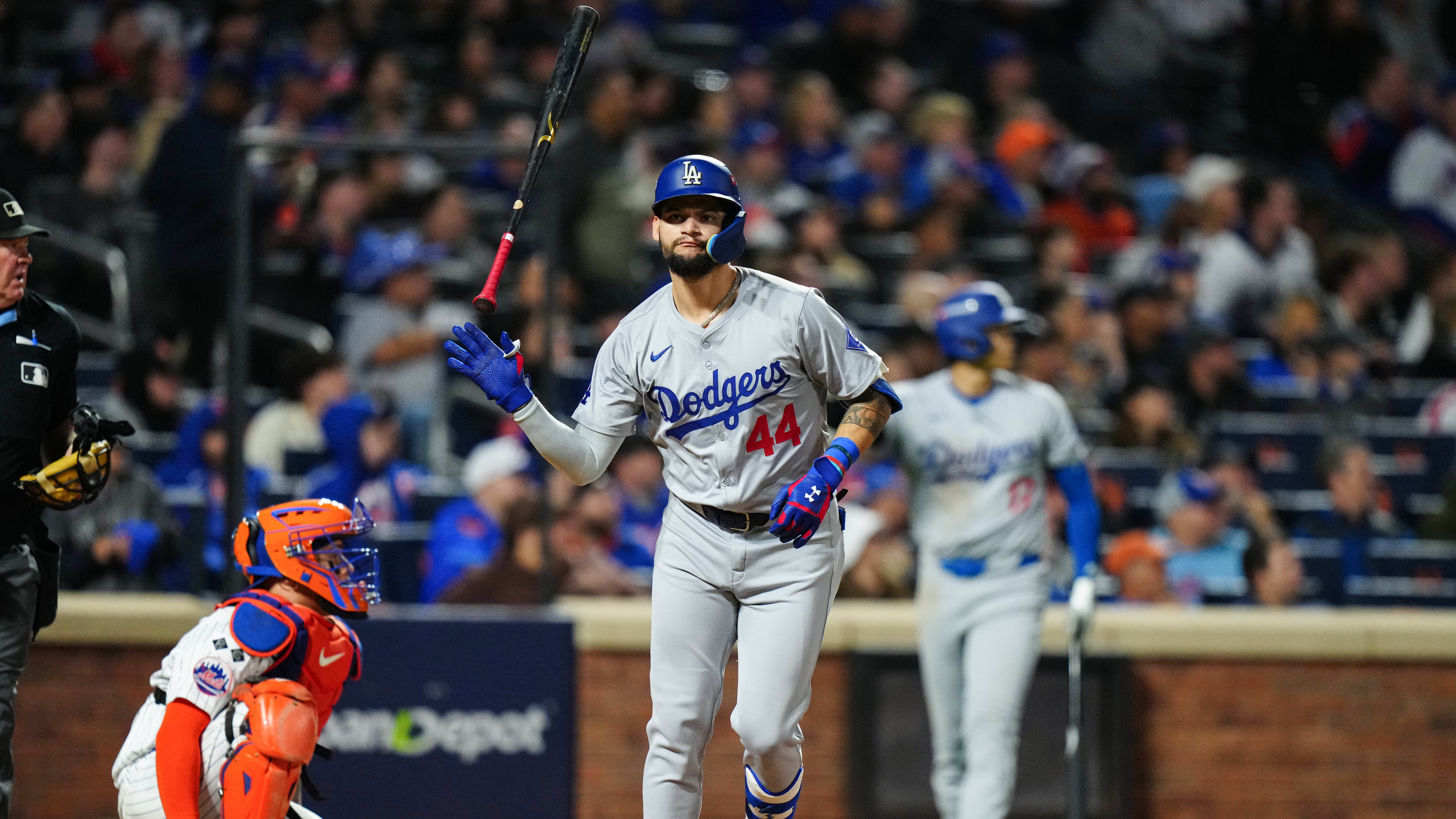 Andy Pages tosses his bat away after one of his home runs