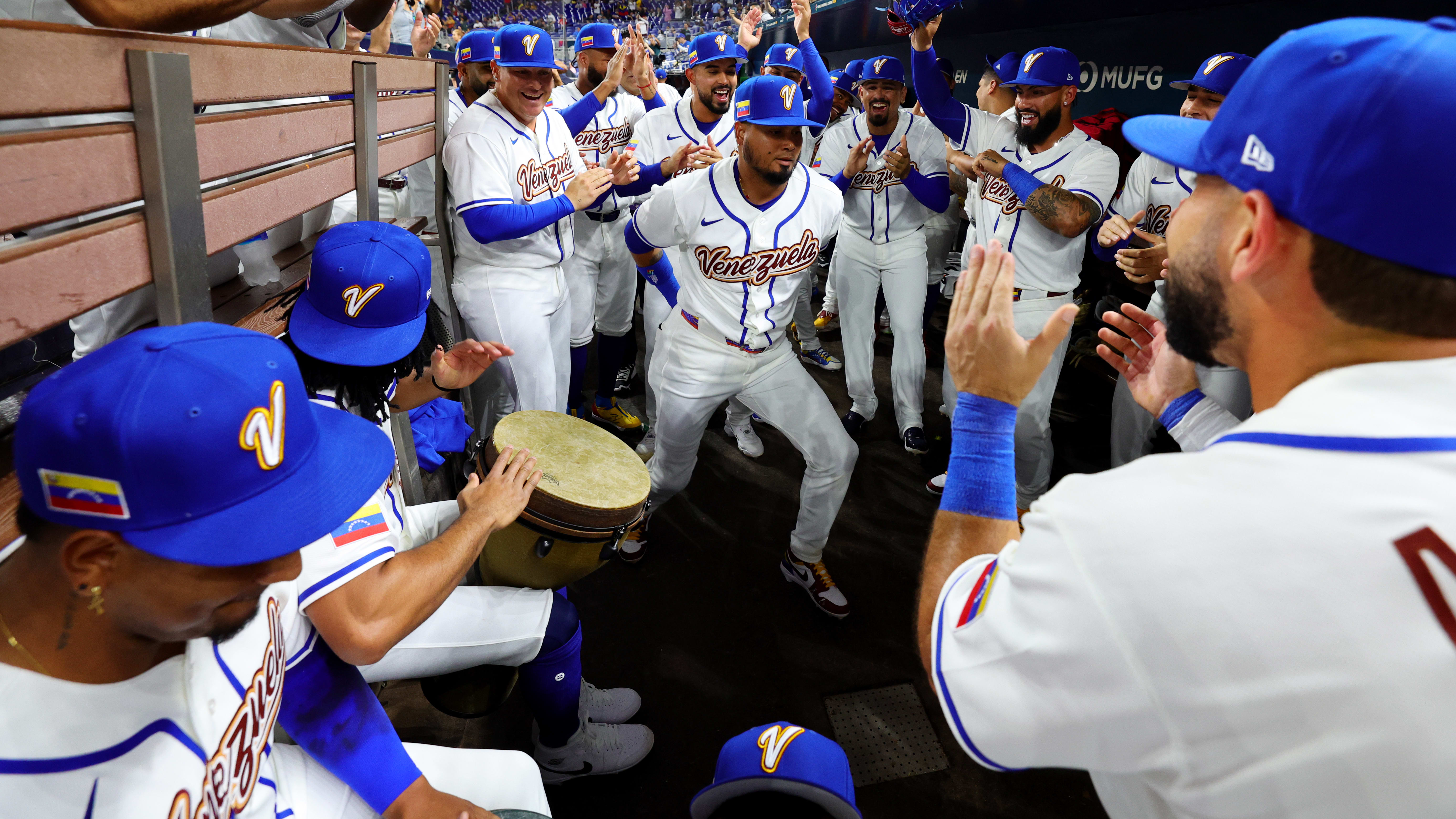 Venezuela players dance in the dugout