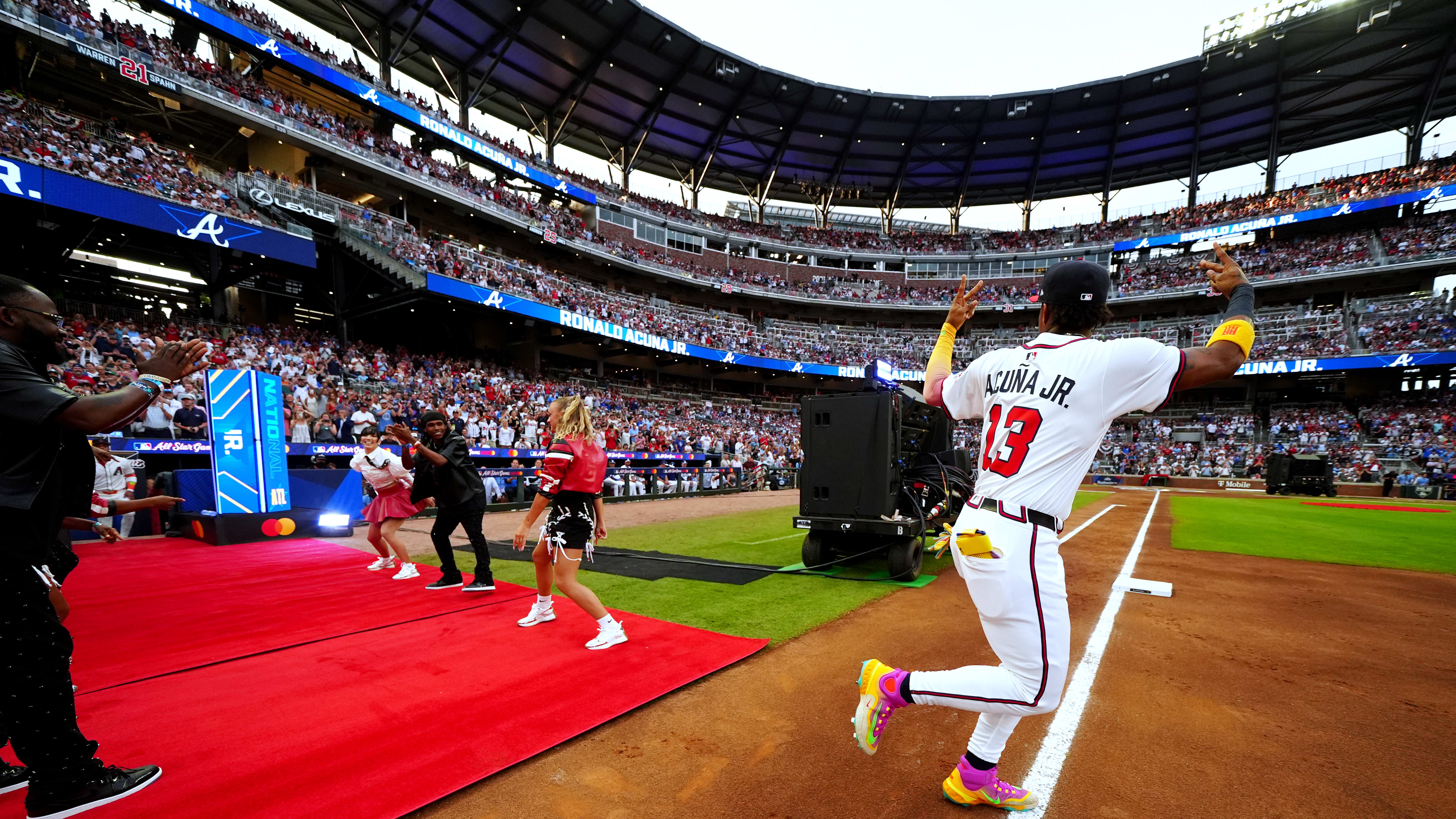 Ronald Acuña Jr. takes the field and acknowledges the fans