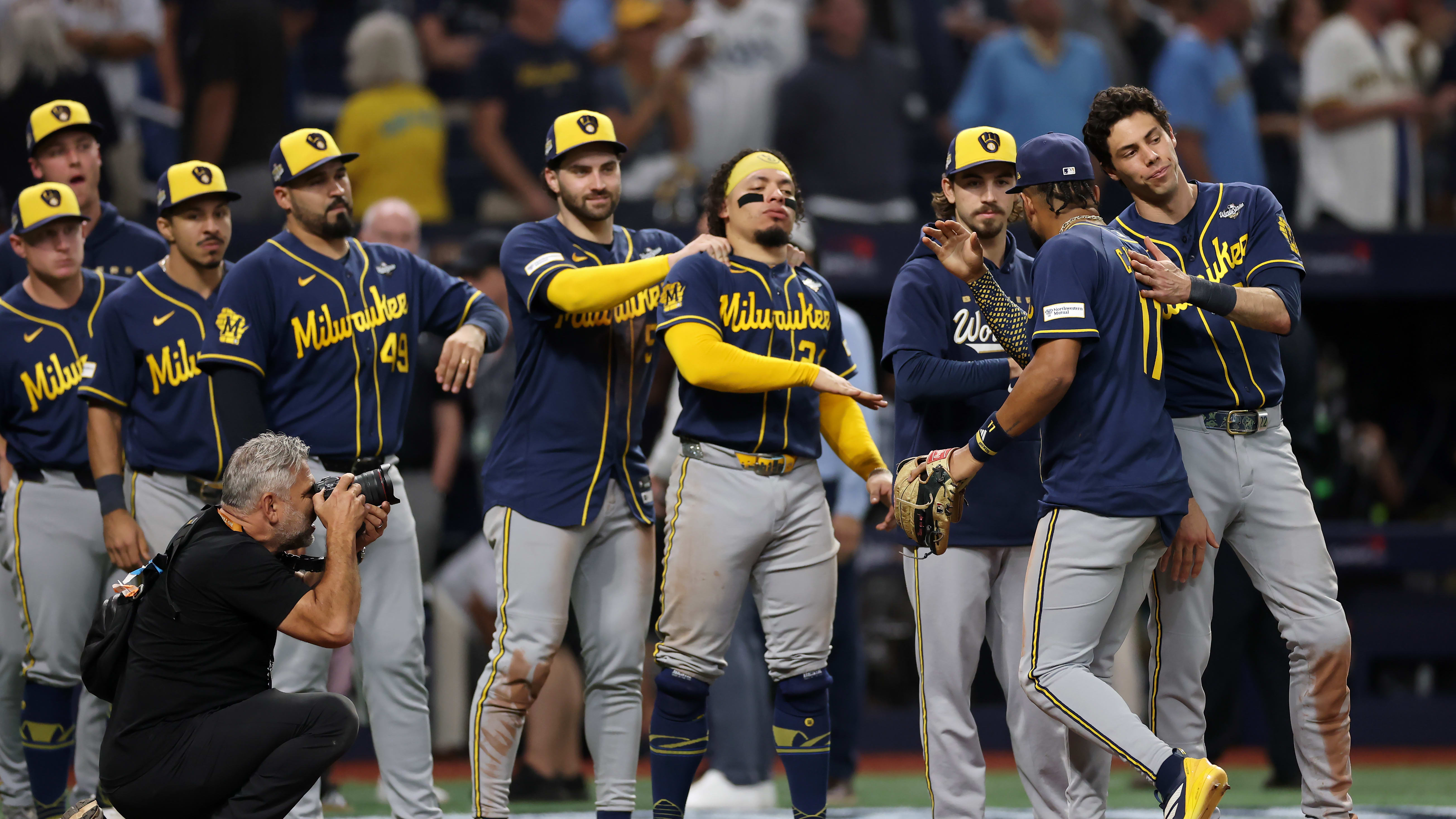 The Brewers congratulate one another after Game 3