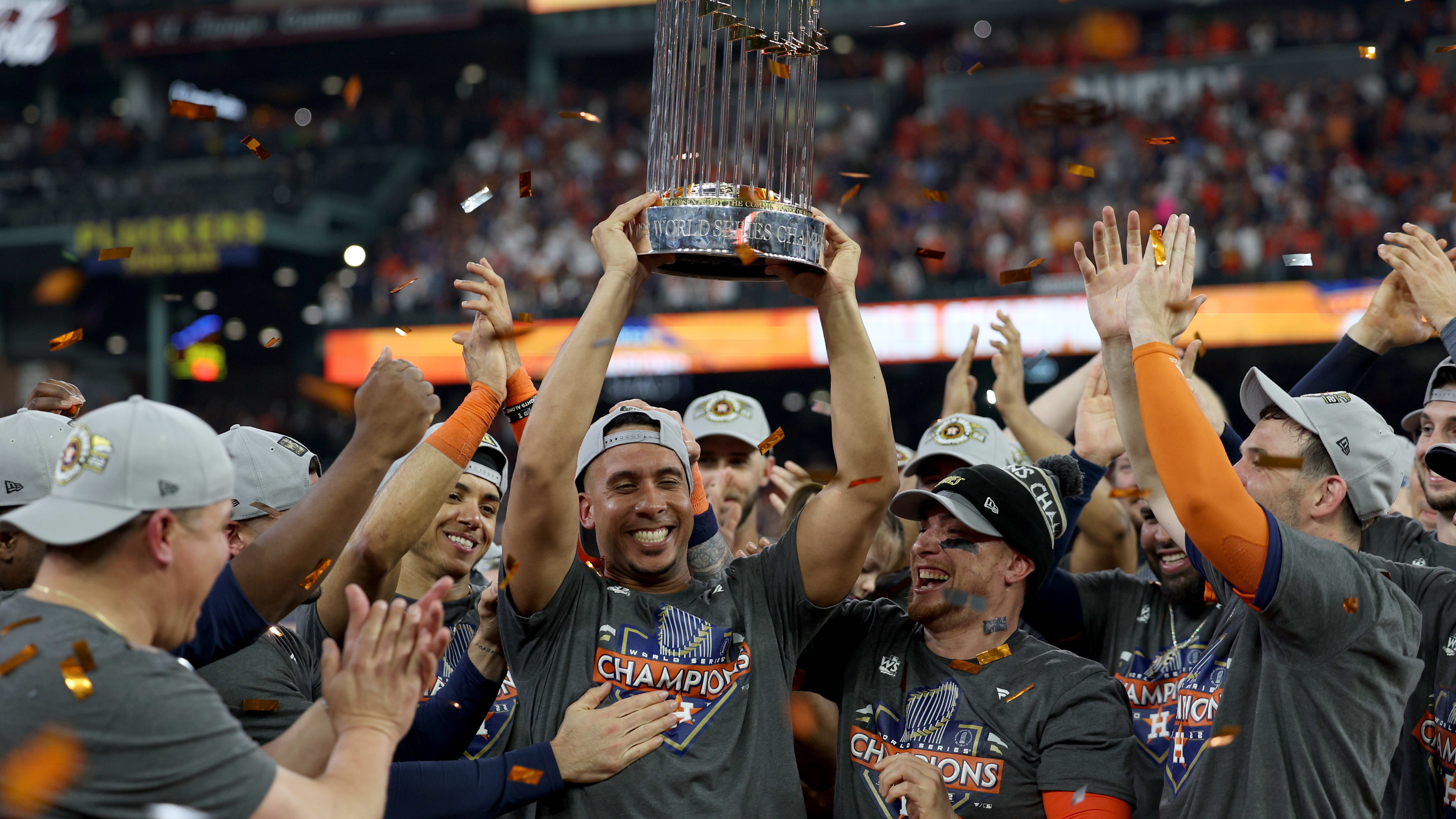 Michael Brantley lifts the World Series trophy