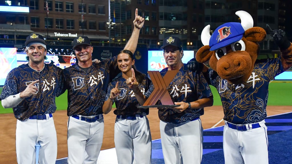 The Bull Dragons' Rick Ankiel, Michael DiMartini and Ana Gold celebrate MLBx win. (Photo by Chris Downey/MLB Photos)