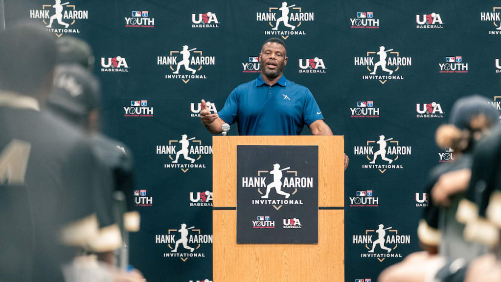 Hall of Famer Ken Griffey Jr. speaks to attendees at the Hank Aaron Invitational at Jackie Robinson Training Complex on Sunday in Vero Beach, Fla.