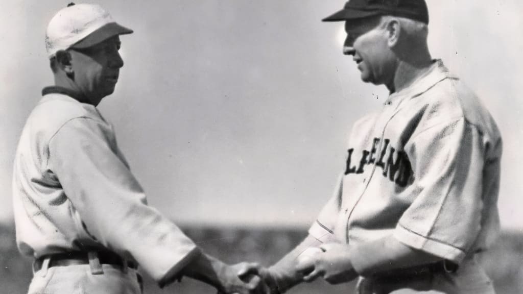 Eddie Collins, left, of Chicago, shakes hands with Tris Speaker of Cleveland, at Comiskey Park in Chicago, Ill., on April 1926.