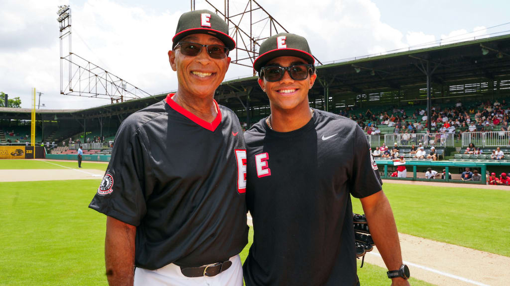 Team West coach Jerry Hairston Sr. and his grandson Jackson Hairston pose for a photo after throwing out the ceremonial first pitch. (Photo by Mary DeCicco/MLB Photos via Getty Images)