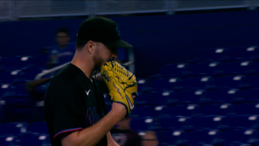 Trevor Rogers puts his name card on the draft board after being