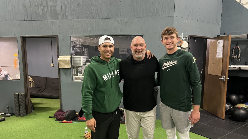 Mark Kotsay with his son Trey, right, and former big leaguer Chris Aguila at Aguila's training facility.