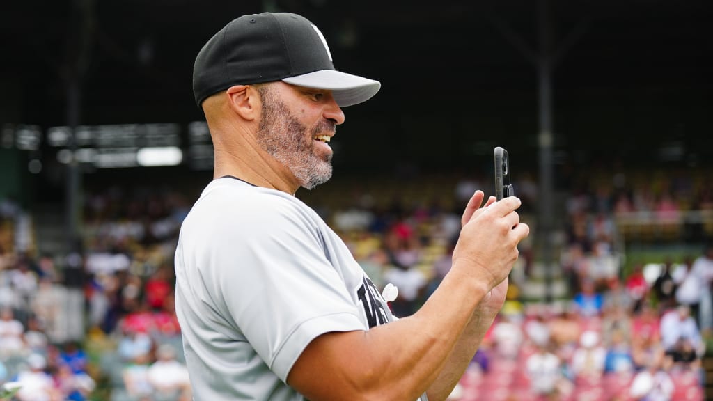 Scott Hairston films his brother Jerry in the 2025 East-West Classic Home Run Derby.