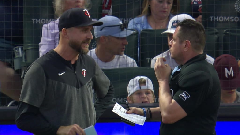 Minnesota Twins' Edouard Julien (47) talks to Carlos Correa