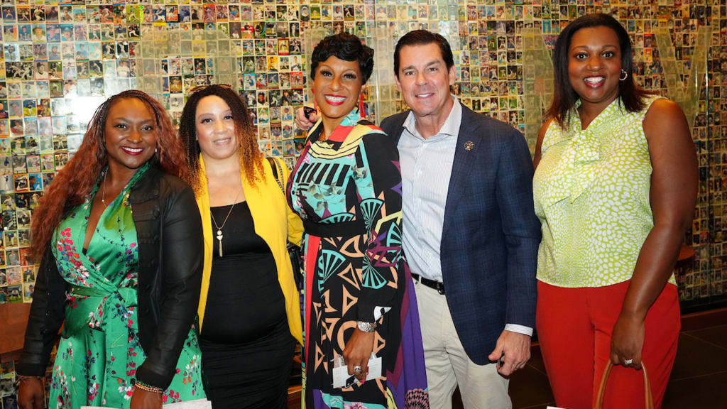 Billy Bean, SVP Diversity, Equity & Inclusion and special assistant to the Commissioner poses for a photo with participants during the Diverse Business Partner Luncheon.