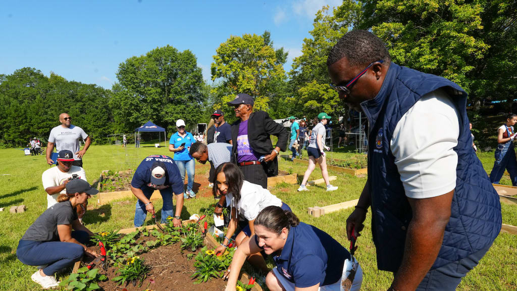 Volunteers work together on tasks to build different areas of the farm during the Leila Valley Urban Farm volunteer project.