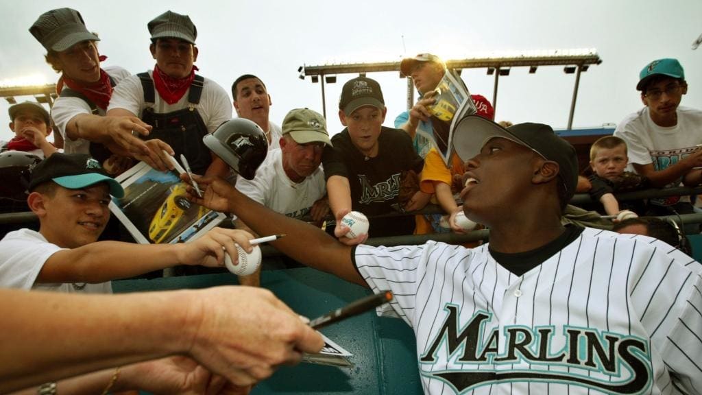 Rob Marcello (far upper left) seeks out an autograph from Dontrelle Willis.