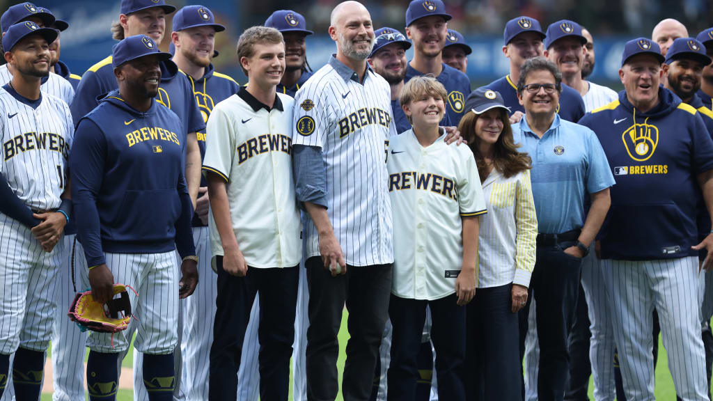 John Axford and his sons with the Brewers after he threw a ceremonial first pitch (Kylie Bridenhagen)