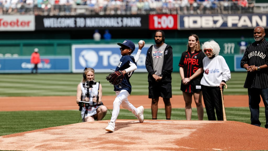 Tre delivers the ceremonial first pitch, as Amir Makle, Skylar Kaplan, Maybelle Blair and William Douglas “Doug” Foster Jr. look on.