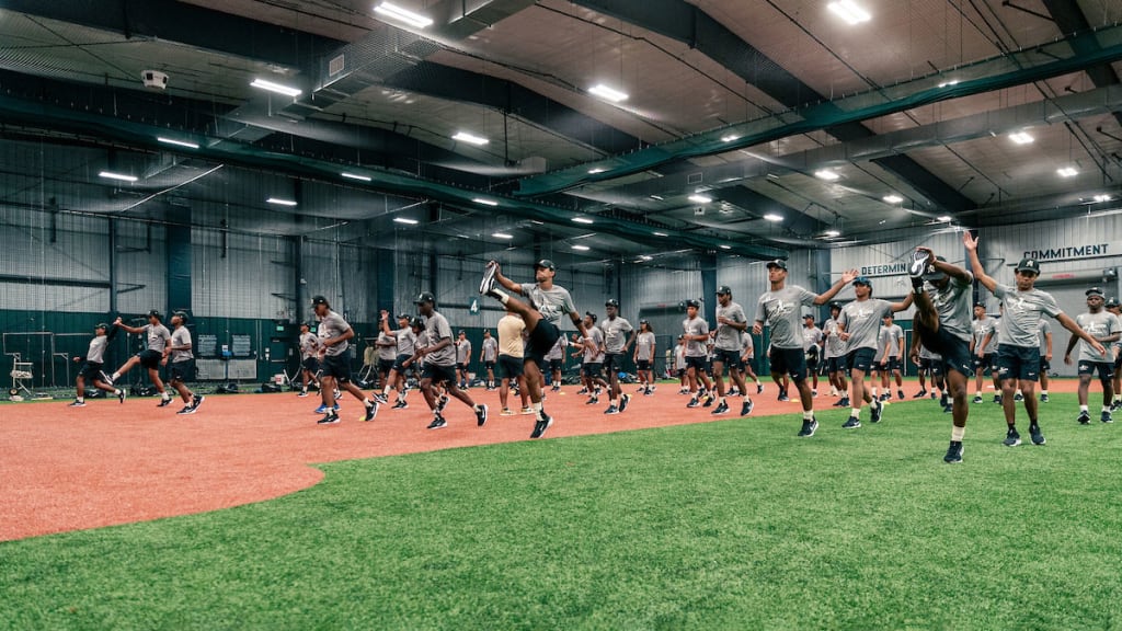 Players work out indoors during the Hank Aaron Invitational at Jackie Robinson Training Complex on Wednesday in Vero Beach, Fla.
