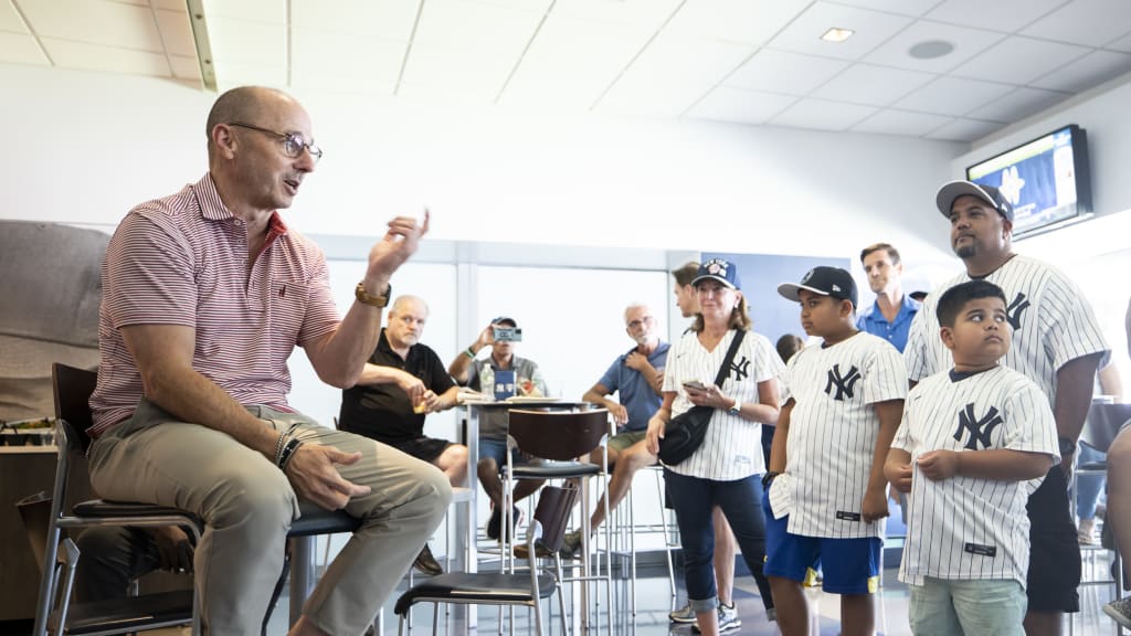 Brian Cashman chats with the attendees at Sunday's event. (Michelle Farsi/Getty Images)