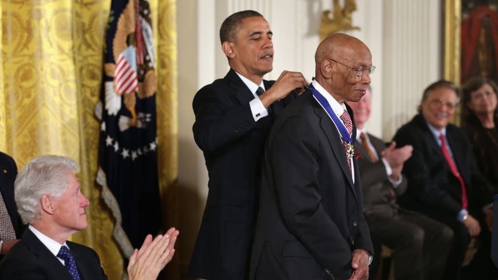 Ernie Banks receives the Presidential Medal of Freedom from President Barack Obama in 2013.
