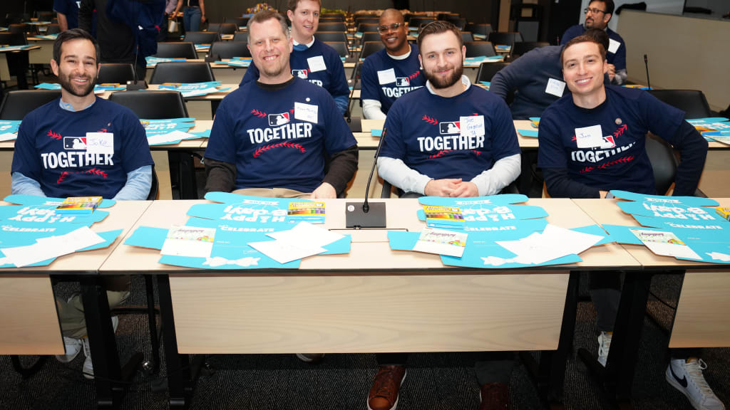Participants pose for a photo during the MLB Together and Foster Love Packing Event at MLB Headquarters.