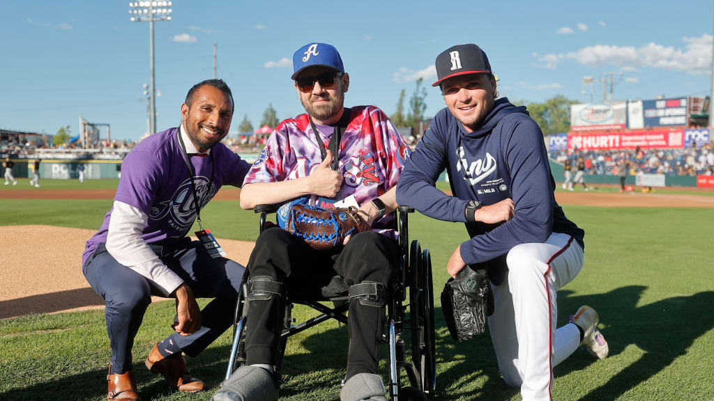 David Calvert flanked by his oncologist, Dr. Harry Menon, and Aces pitcher Tommy Henry.