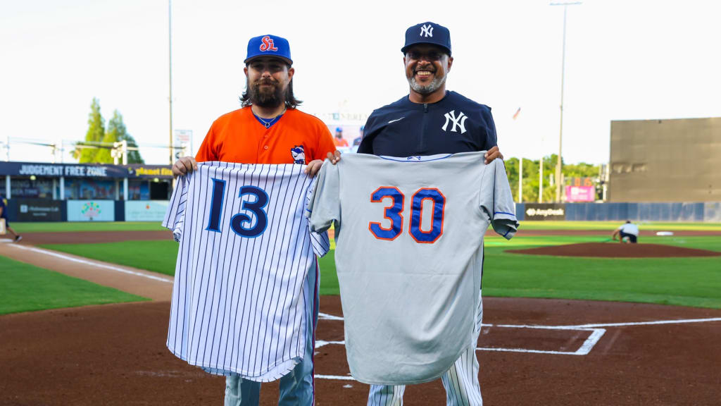 Jonathon Cramman (left) and Drew Spencer exchange jerseys before their Minor League teams play a doubleheader.