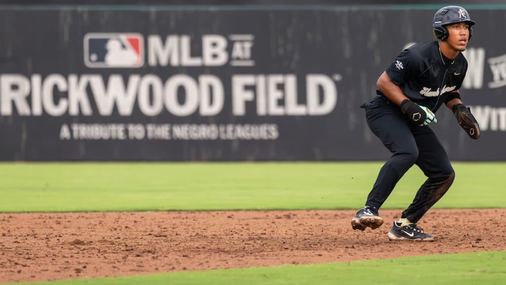Rookie Shepard II leads off second base with the Rickwood Field sign in the background.